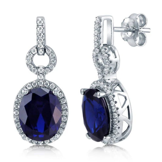 Halo Simulated Blue Sapphire Oval CZ Dangle Earrings in Sterling Silver