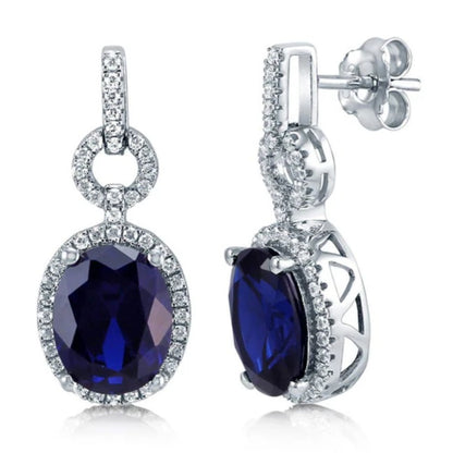 Halo Simulated Blue Sapphire Oval CZ Dangle Earrings in Sterling Silver