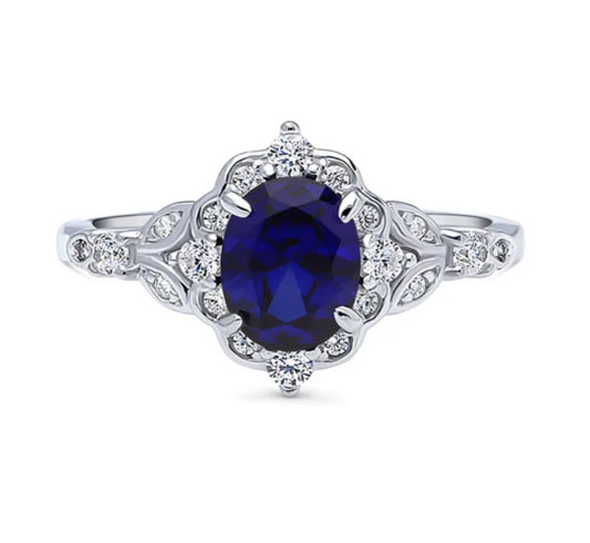 Halo Art Deco Simulated Blue Sapphire Oval CZ Ring in Sterling Silver