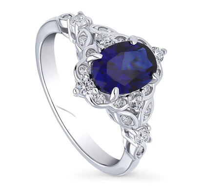 Halo Art Deco Simulated Blue Sapphire Oval CZ Ring in Sterling Silver